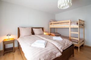 a bedroom with a bunk bed with two towels at Bieślin 41 in Bieślin