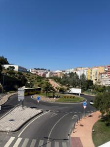 an empty street with a road in a city at Casa Noir Luxury 3BR Apartment 2 Baths Near Lisbon & Sintra in Queluz