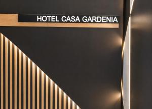 a hotel casa gardenia sign on the side of a building at Hotel Casa Gardenia by Blossom Hotels in Barcelona +67 photos