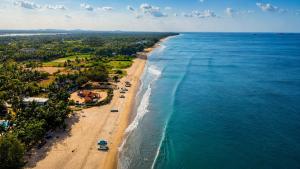 an aerial view of a beach and the ocean at Sheen Coast Beach Cabana in Nilaveli