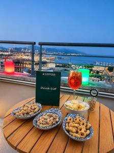 a table with plates of food and a glass of wine at Allegroitalia La Spezia 5 Terre in La Spezia