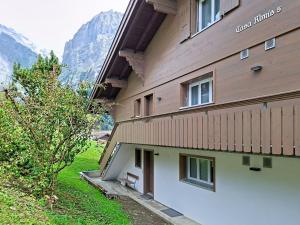 a building with a bench on the side of it at Apartment Chalet Almis 5 by Interhome in Grindelwald