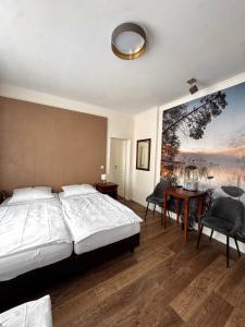 Llit o llits en una habitació de Hotel Baden