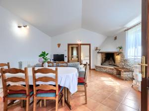 a dining room with a table and a fireplace at Holiday Home Tomazin by Interhome in Pazin