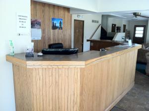 a large wooden counter in a room at Brooks Motel in Norton