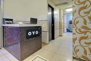 an office lobby with a yes sign on a counter at Collection O The Legend Hotel, Hisar in Hisār