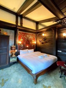 a bedroom with a large bed in a room at Five Star Guest house in Chiang Mai +42 photos
