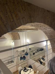 a kitchen with a sink and a brick wall at 16 zeros villa in Paralia Katerinis