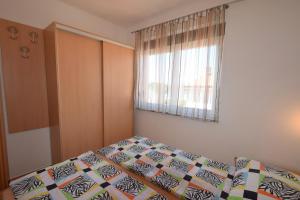 Postel nebo postele na pokoji v ubytování Apartment Jela