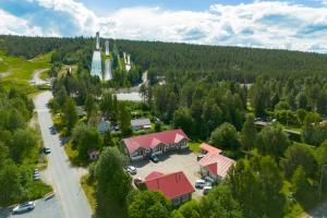 an aerial view of a resort with a building and trees at Apartment A 3 Talja, Private Sauna By Lapland Host in Rovaniemi