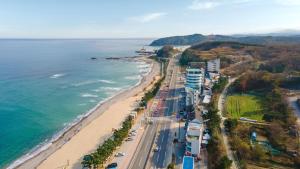 an aerial view of a beach and the ocean at Yangyang Haetteuneun Changmun Pet-Friend in Yangyang
