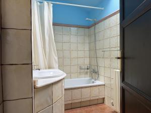 a bathroom with a tub and a sink and a shower at BLEU MAISON-PAZO 2 CL in Campo Lameiro +87 photos