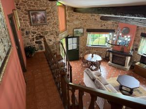 an overhead view of a living room with a table and chairs at BLEU MAISON-PAZO 2 CL in Campo Lameiro