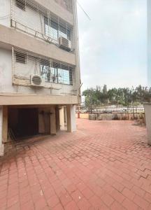 a brick parking lot in front of a building at Crystal Luxury Hotel in Mumbai