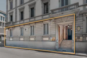 a building with a door and stairs in front of it at Fiume 20 - Residence in Florence