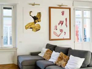 a living room with a couch and a picture at La Casa Del Pittore - Centro Storico in Legnano