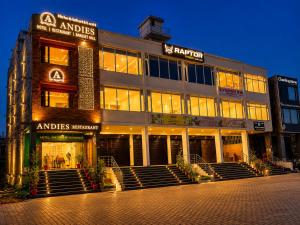 a large building with stairs in front of it at Hotel Andies in Mohali