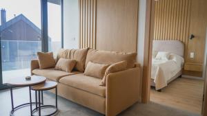 a living room with a couch and a bed at Wisła View, Sun&Snow in Wisła +35 photos