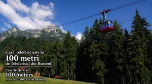 a gondola ride in a resort with a mountain at Casa Teleferic in Buşteni