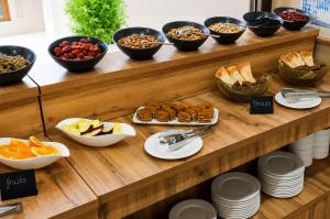 a buffet with many bowls of different types of food at Arda Karvon Saroy in Khiva