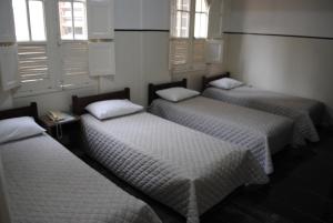 Cama ou camas em um quarto em Sul América Palace Hotel