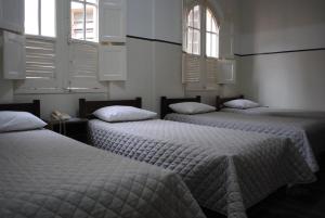 Cama ou camas em um quarto em Sul América Palace Hotel