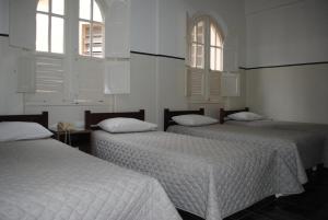 Cama ou camas em um quarto em Sul América Palace Hotel