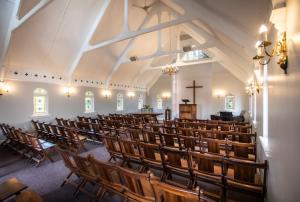 a church with rows of chairs in a room at Sica's Guest House in Durban +72 photos