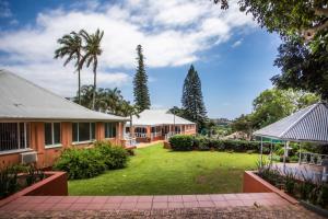 an image of a house with a yard at Sica's Guest House in Durban