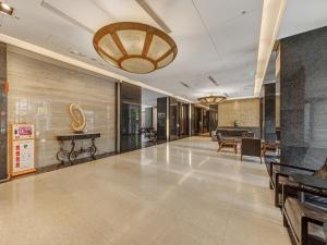 an empty lobby with a large ceiling at Guide Hotel Taipei Chongqing in Taipei