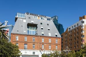 a building on top of a brick building at ONOMO Hotel Waterfront in Cape Town