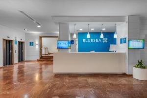 a lobby of a building with a reception desk at BLUESEA Al Andalus in Torremolinos