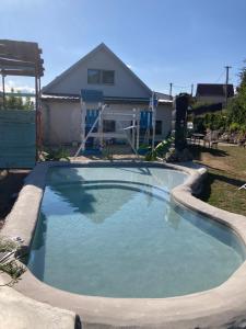 a large swimming pool in front of a house at chata Viňanka in Michalovce