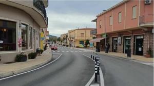 an empty street in a town with buildings at Valledoria Central Modern Studio in Valledoria