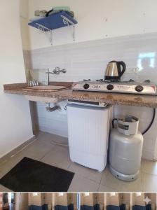 a kitchen with a stove and a counter top at dalina resort in El Alamein