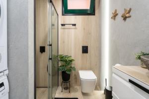 a bathroom with a toilet and a glass shower at Paz Ocean View Luxury, 2 Air conditioners, Fast Wifi, Heated pool in San Miguel de Abona +79 photos
