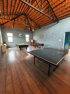 a large room with a ping pong table in it at The Yellow Retreat in Wai