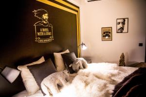 Postel nebo postele na pokoji v ubytování Boutique Hotel Mustaparta