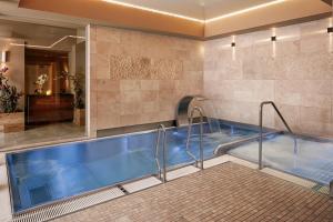 a jacuzzi tub in a hotel room at Kosher Hotel King David Prague in Prague