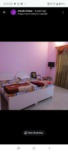 a picture of a bedroom with a large bed at Hare Krishna hotel in Orchha