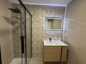 a bathroom with a sink and a shower at AMANITA VuT in Huerta del Rey +10 photos