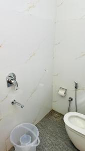 a bathroom with a sink and a toilet at HoTEL KAMAL VINTAGE in Kāthgodām