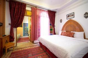 Postel nebo postele na pokoji v ubytování Riad Tahra & Spa