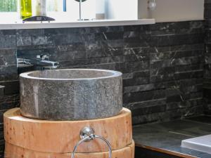 a sink on top of a wooden barrel in a bathroom at Waterside Lodge in Lockerbie +27 photos