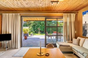 a living room with a couch and a table at Villa Mona Lisa in Seefeld in Tirol