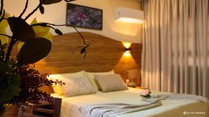 Cama ou camas em um quarto em Terra dos Diamantes Hotel