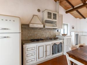 a kitchen with a white refrigerator and a sink at Apartment Siena by Interhome in Vergelle