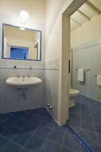 a bathroom with a sink and a mirror at Apartment Siena by Interhome in Vergelle +43 photos