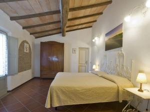 a bedroom with a large bed with a yellow blanket at Apartment Siena by Interhome in Vergelle
