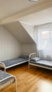 a room with three bunk beds in it at VIP hostel in Mukacheve